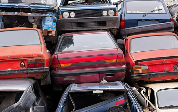 A chaotic pile of junk cars, representing the need for Fast Cash for Junk Cars in Alpharetta GA.